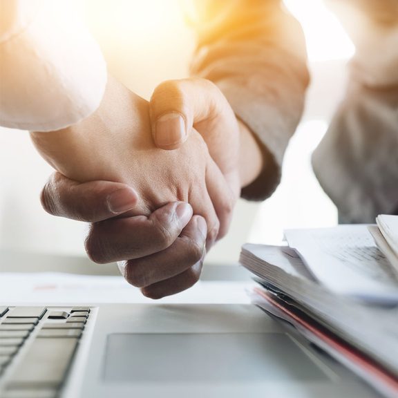Close up of two hands shaking