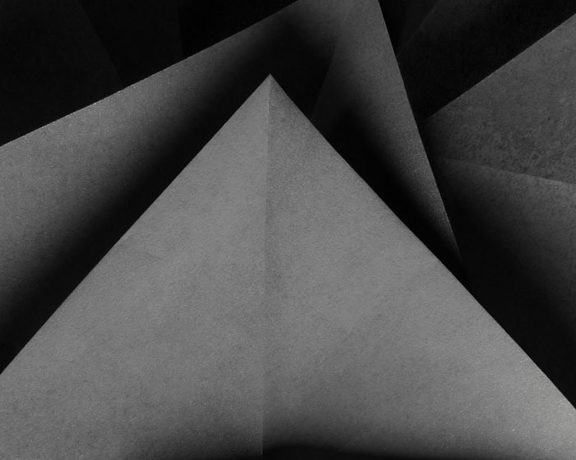 Gray triangles on dark background