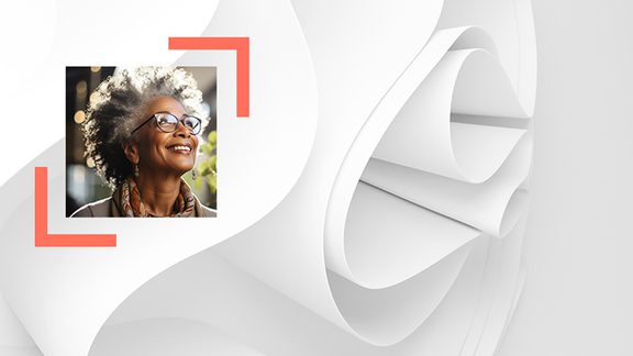 picture of a woman smiling with a paper roll behind