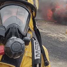 Photo of person in fire fighter mask
