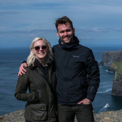 Photo of two people on a mountain top