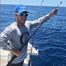 Photo of a person with a fishing pole