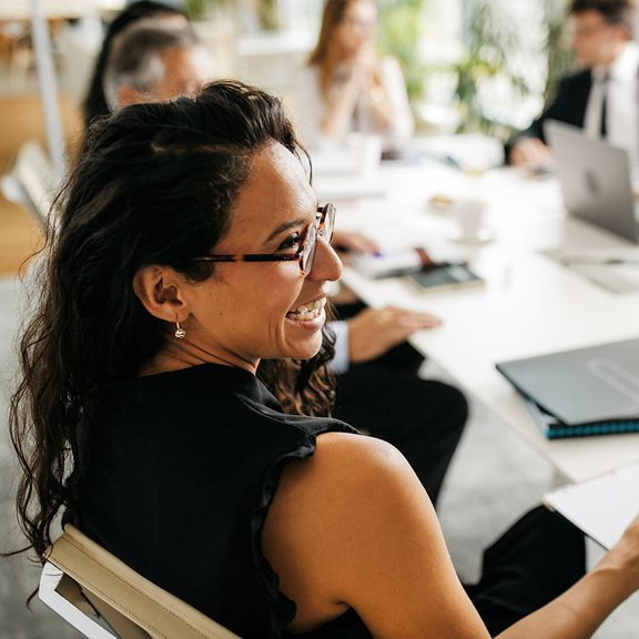 Woman at a conference table