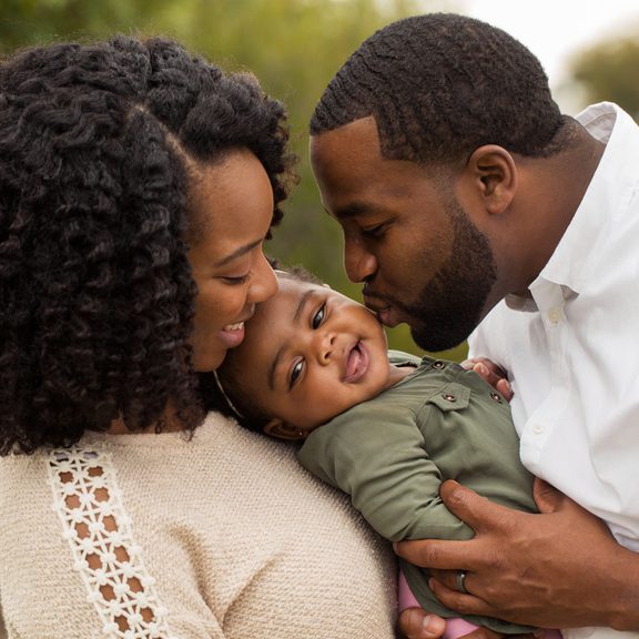Young black couple with infant